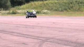 Flyby shot of Richard longman driving my ProMotive Mini 1275gt at Bruntingthorpe proving ground 09 [upl. by Llednik]