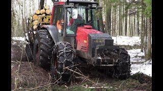 Valtra forestry tractor logging in wet winter forest [upl. by Eldreda637]