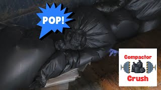 Trash compactor crushing and popping black bags [upl. by Snapp]