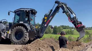 HUDDIG 1260E backhoe loader with Rototilt R4 road excavation for fiber optics [upl. by Kurtz]