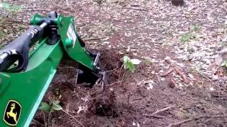 Removing an OLD Stump with the John Deere 1023e Backhoe [upl. by Ojaras]