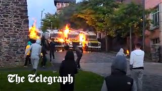 Nationalist youth throw petrol bombs at police in Northern Ireland [upl. by Lodmilla]