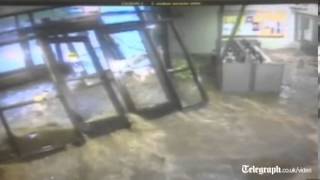 Dramatic footage Flash flood rips off doors engulfing school lobby in Illinois [upl. by Cyprian190]