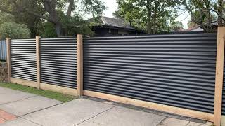 Corrugated steel exposed post fence with sleeper Automatic sliding gate [upl. by Belva]