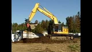 Track Hoe And Dump Trucks Work Together To Dig Dirt At Construction Site  Truck Videos [upl. by Wera]