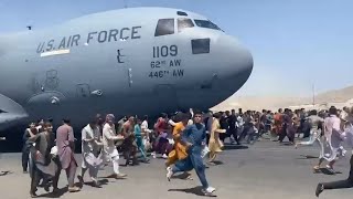 Watch Afghans Run Alongside US Military Plane At Kabul Airport [upl. by Ahsiekin]