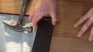 How to Install Laminate Flooring Part 1  Tapping Block [upl. by Adnaram]