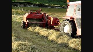 Rowing amp Baling Hay 2 MF 135 and MF 20 Baler 2011 [upl. by Nefets]