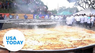 El Salvador cooks up what it says is a world record for pupusa dish  USA TODAY [upl. by Rofotsirk896]