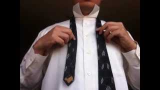 How to tie a very easy beginner tie in under 60 seconds schoolboy knot oriental knot [upl. by Archangel907]