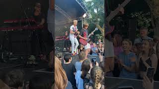 Cant believe this happened 🤯 10 year old asks band at festival to let him play guitar [upl. by Adnimra]