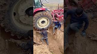 The process of rescuing an agricultural tractor after its rear wheel got stuck in a mud pit [upl. by Scibert376]