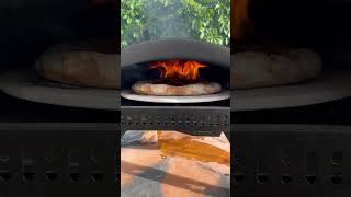 Cooking pizza unedited in the new Bertello SimulFIRE 16quot Rotating Outdoor Pizza Oven [upl. by Ailat]