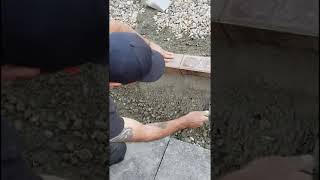 Haunching concrete using a gauging trowel setting in 80mm block pavers 🔥shorts [upl. by Humfried]