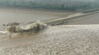 Spectacular tidal bore along Qiantang river mesmerizes thousands in east China [upl. by Rubbico]