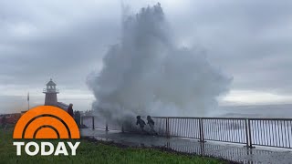 Rogue waves slam California beach knocking down onlookers [upl. by Xino189]