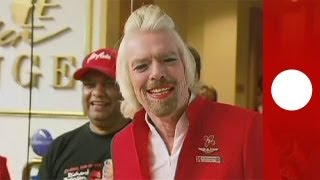 Virgin Group founder Richard Branson works as stewardess for a day [upl. by Sev]