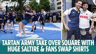 Tartan Army play football on huge Saltire and fans swap shirts in Cologne [upl. by Nevram665]