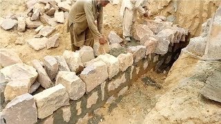 Construction of stone masonry wall [upl. by Rorrys]