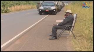 President Museveni answers a phone call by the roadside [upl. by Brittni957]