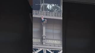 Person spotted scaling Eiffel Tower hours before Olympics Closing Ceremony [upl. by Parent]